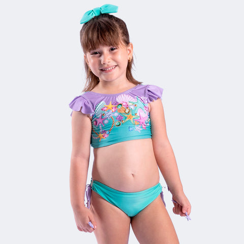 Biquíni Kids Top Cropped Viva Flor Cristais com Babado e Laço Verde e Lilás - 6 a 14 Anos - menina com o biquíni